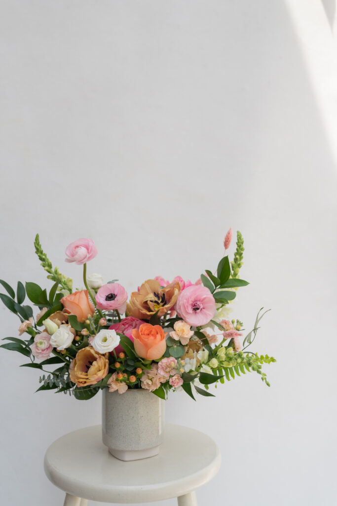 a big vase with lots of colorful flowers in it